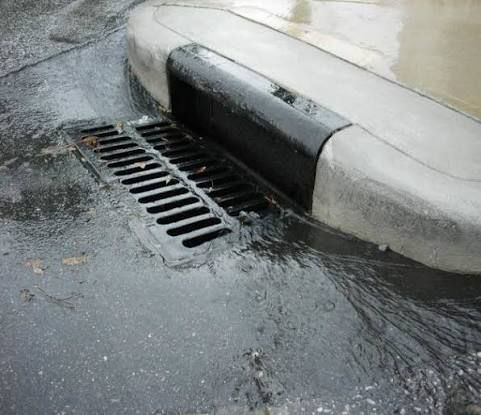 Completed township road with kerbing, line markings and stormwater side channel